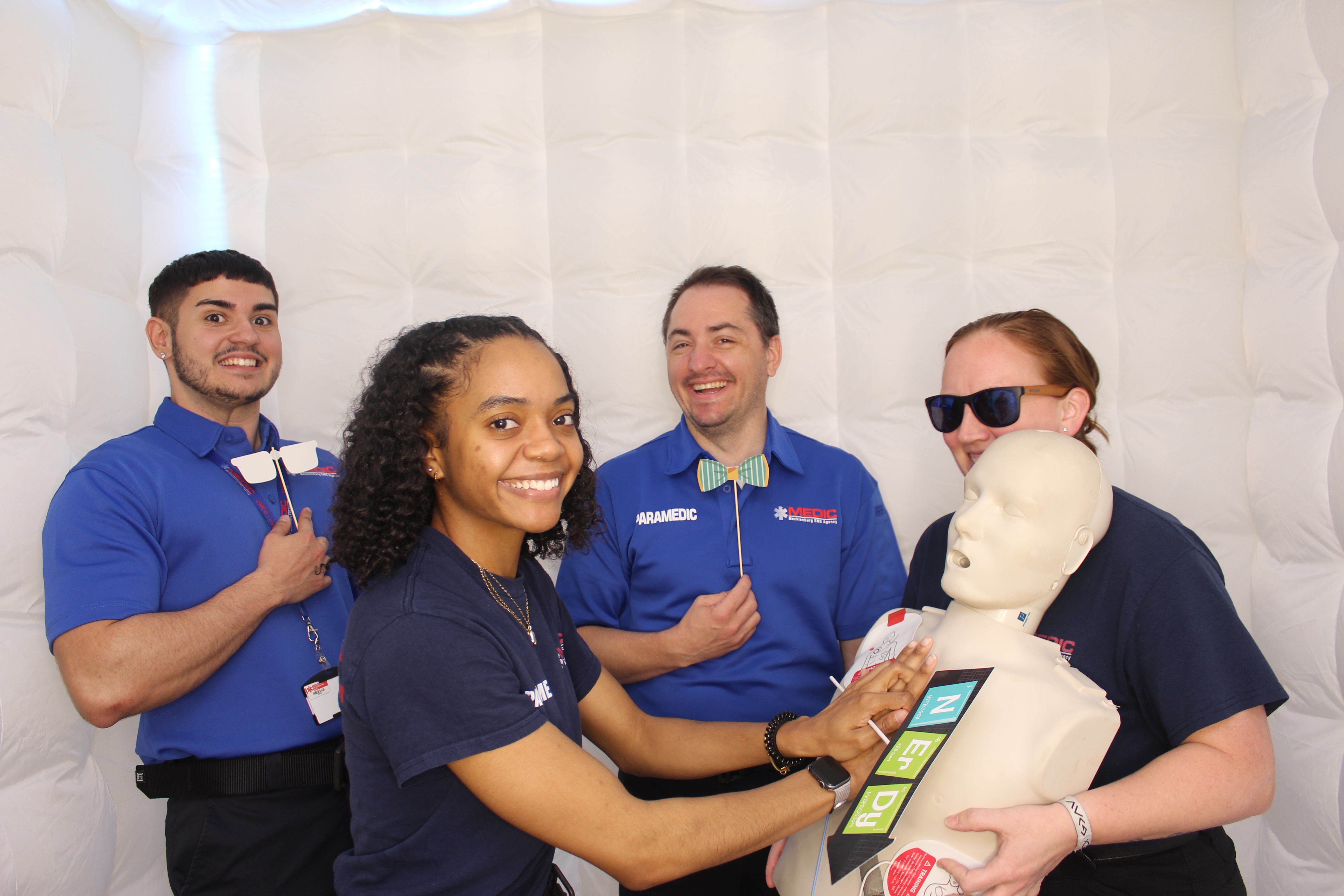 Paramedic team with training dummy