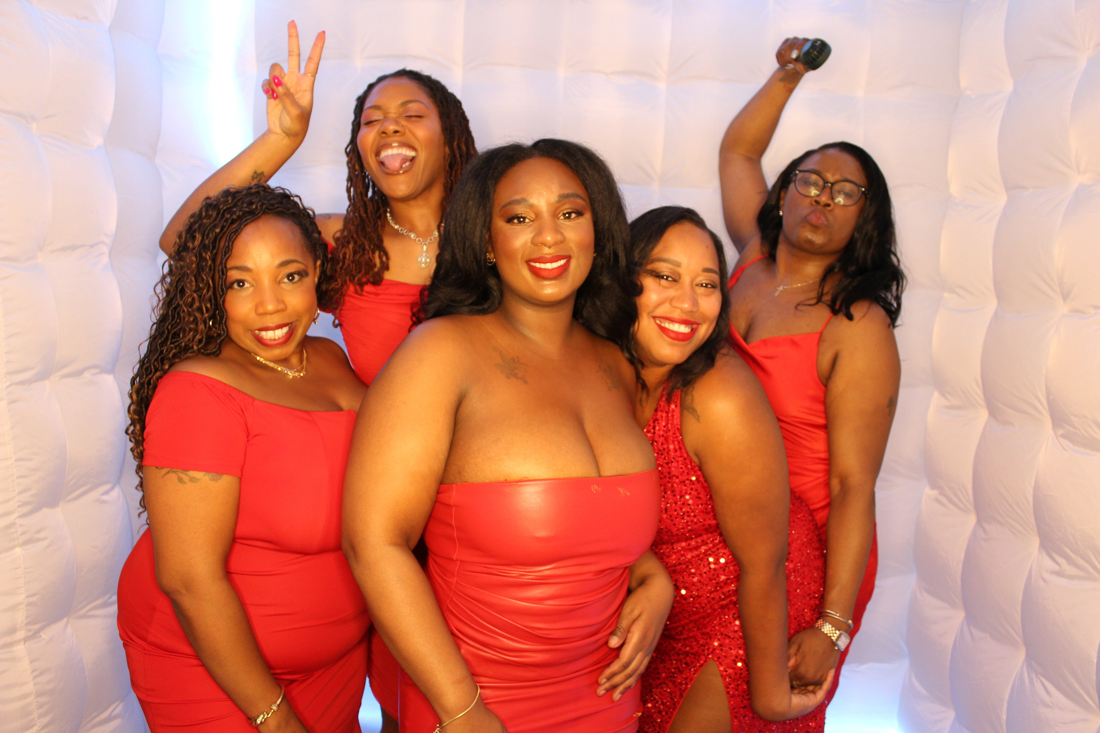 Friends celebrating in red dresses